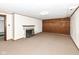 Finished basement featuring a fireplace, storage, carpeted floors, and paneled walls for a cozy retreat at 25 W 59Th St, Indianapolis, IN 46208