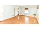 Spacious bedroom with hardwood floors, closet, and a window with light-blocking shade at 25 W 59Th St, Indianapolis, IN 46208