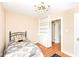 Bright bedroom featuring a twin bed, wood floors and built in bookshelf at 25 W 59Th St, Indianapolis, IN 46208