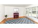 Cozy bonus room featuring hardwood floors, white walls, and a large window with natural light at 25 W 59Th St, Indianapolis, IN 46208