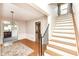 Welcoming foyer with hardwood floors, a staircase, and views into adjacent living spaces at 25 W 59Th St, Indianapolis, IN 46208