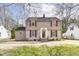 Charming two-story home with a stone facade, classic shutters, and a well-manicured lawn at 25 W 59Th St, Indianapolis, IN 46208