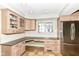 Bright kitchen features stainless steel appliances, built-in cabinets and countertop space at 25 W 59Th St, Indianapolis, IN 46208