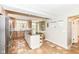 Spacious kitchen with large island, stainless steel refrigerator, and lots of light from the window at 25 W 59Th St, Indianapolis, IN 46208