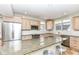Spacious kitchen featuring granite countertops, stainless steel appliances, and ample cabinet space at 25 W 59Th St, Indianapolis, IN 46208
