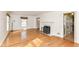 Large living room features a fireplace, wood floors and access to the kitchen at 25 W 59Th St, Indianapolis, IN 46208