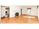 Bright living room with hardwood floors, a decorative fireplace, and large windows at 25 W 59Th St, Indianapolis, IN 46208