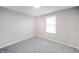 This bedroom has a window for natural light and neutral carpet at 2511 Ritter Dr, Anderson, IN 46012