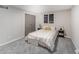 A bright bedroom with carpet and a nicely decorated double bed at 2511 Ritter Dr, Anderson, IN 46012