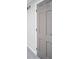 A grey bedroom door with white trim and bronze hardware at 2511 Ritter Dr, Anderson, IN 46012