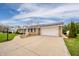 Spacious ranch home with a long, wide driveway leading to an attached two-car garage at 2511 Ritter Dr, Anderson, IN 46012