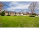 Quaint ranch style home with a well kept lawn and an attached garage at 2511 Ritter Dr, Anderson, IN 46012