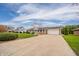 Single-story home featuring a long driveway and a well-maintained front yard with landscaping at 2511 Ritter Dr, Anderson, IN 46012