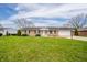 Lovely ranch home featuring a lush front yard, attached garage and inviting entryway at 2511 Ritter Dr, Anderson, IN 46012
