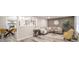 Stylish living room with modern furniture, wood floors, and a view into the dining area at 2511 Ritter Dr, Anderson, IN 46012