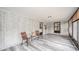Cozy sun room with brick walls and vinyl floors at 2511 Ritter Dr, Anderson, IN 46012