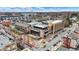 Aerial view of a commercial building with street parking surrounded by neighborhood homes at 253 1St Nw St, Carmel, IN 46032