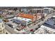 Aerial view of a commercial building with street parking surrounded by neighborhood homes at 253 1St Nw St, Carmel, IN 46032