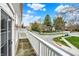 Scenic view from the balcony showcases the neighborhood's charming street and lush greenery at 253 1St Nw St, Carmel, IN 46032