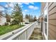 Overlooking a quiet neighborhood, the balcony offers views of well-maintained lawns and charming homes at 253 1St Nw St, Carmel, IN 46032