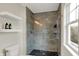 Bathroom featuring a shower, toilet, and floating shelves at 253 1St Nw St, Carmel, IN 46032