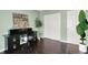 Well-lit bedroom with a desk, hardwood floors, and a closet at 253 1St Nw St, Carmel, IN 46032