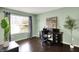 Well-lit bedroom with a desk, hardwood floors, and a large window at 253 1St Nw St, Carmel, IN 46032