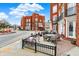 Attractive brick building with outdoor seating and vibrant landscaping on a sunny day at 253 1St Nw St, Carmel, IN 46032