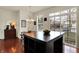 Bright kitchen featuring a center island, modern decor, and large windows at 253 1St Nw St, Carmel, IN 46032