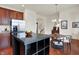 Spacious kitchen with stainless steel appliances, dark wood cabinets, and a cozy dining nook at 253 1St Nw St, Carmel, IN 46032
