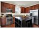 Well-appointed kitchen features stainless steel appliances, granite countertops, and wood cabinetry at 253 1St Nw St, Carmel, IN 46032
