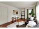 Inviting living room with hardwood floors, matching chairs and lots of natural light from the window at 253 1St Nw St, Carmel, IN 46032
