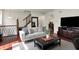 Open living area with hardwood floors, staircase, and comfortable seating at 253 1St Nw St, Carmel, IN 46032