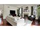 Bright living room with fireplace, television, and hardwood floors at 253 1St Nw St, Carmel, IN 46032
