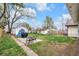 Spacious backyard featuring a seating area, mature trees, and plenty of space for entertaining at 2737 Napoleon St, Indianapolis, IN 46203