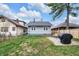 This backyard is fenced and features an outdoor seating area and a grill at 2737 Napoleon St, Indianapolis, IN 46203
