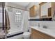 This bathroom features a shower over tub, sleek vanity, and modern fixtures at 2737 Napoleon St, Indianapolis, IN 46203