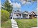 Charming home featuring a welcoming front porch with seating and well-maintained landscaping at 2737 Napoleon St, Indianapolis, IN 46203