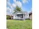 Charming home featuring a welcoming front porch with seating and well-maintained landscaping at 2737 Napoleon St, Indianapolis, IN 46203