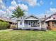 Charming home featuring a welcoming front porch with seating and well-maintained landscaping at 2737 Napoleon St, Indianapolis, IN 46203