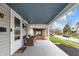 Inviting covered front porch with seating, offering a cozy outdoor space at 2737 Napoleon St, Indianapolis, IN 46203