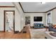 Inviting living room with hardwood floors, decorative trim, and a comfortable seating area at 2737 Napoleon St, Indianapolis, IN 46203