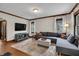 Inviting living room with hardwood floors, decorative trim, and a comfortable seating area at 2737 Napoleon St, Indianapolis, IN 46203