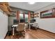 Bright office space with hardwood floors, shelving, and natural light, perfect for remote work at 2737 Napoleon St, Indianapolis, IN 46203