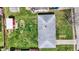 Bird's eye view of home with spacious yard, red shed, and well-maintained roof in a residential area at 318 Winfield St, Greenfield, IN 46140