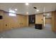 Carpeted basement featuring a closet with wardrobe storage and a small window for natural light at 318 Winfield St, Greenfield, IN 46140
