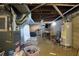 Unfinished basement with exposed ductwork and equipment, offering potential for customization and storage at 318 Winfield St, Greenfield, IN 46140