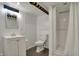 Clean and bright bathroom featuring a toilet, shower, vanity, and mirror, providing essential amenities at 318 Winfield St, Greenfield, IN 46140
