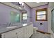 Updated bathroom with double vanity, modern fixtures, and a glass shower door at 318 Winfield St, Greenfield, IN 46140