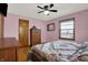 Comfortable bedroom featuring wood floors, window and ceiling fan at 318 Winfield St, Greenfield, IN 46140